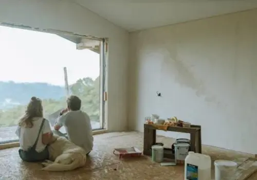 A couple relaxing with their dog.